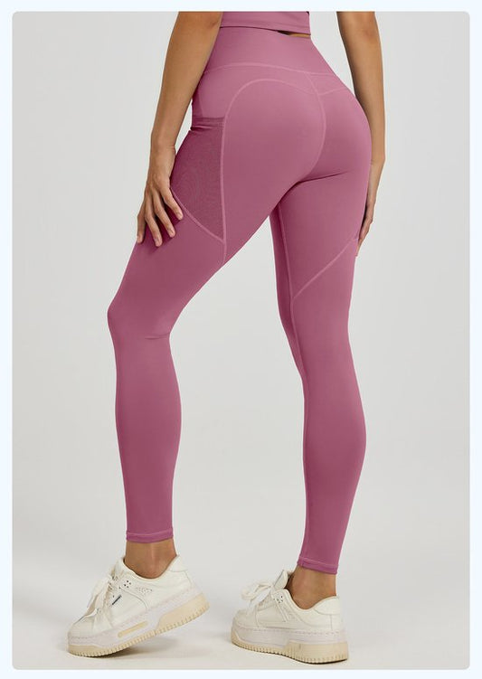 Dark Pink leggings worn by a person on a white background