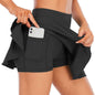 Person wearing black shorts with a pocket holding a phone, on a white background