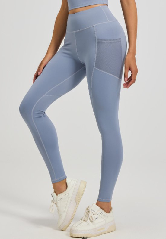 Light blue leggings worn by a person on a white background