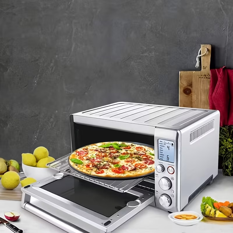 Two pizza baking pans, each 30.48 cm in diameter, feature ventilation holes for improved cooking efficiency and a non-stick coating, making them ideal for oven use.