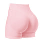 Pink high-waisted shorts on a white background