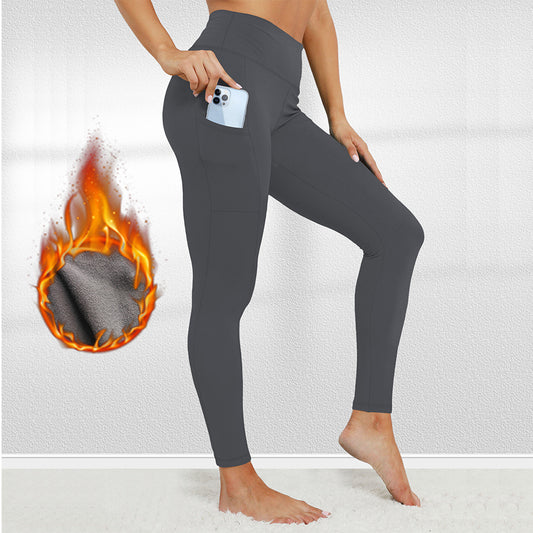 Person wearing gray leggings with a close-up of the fabric on fire.