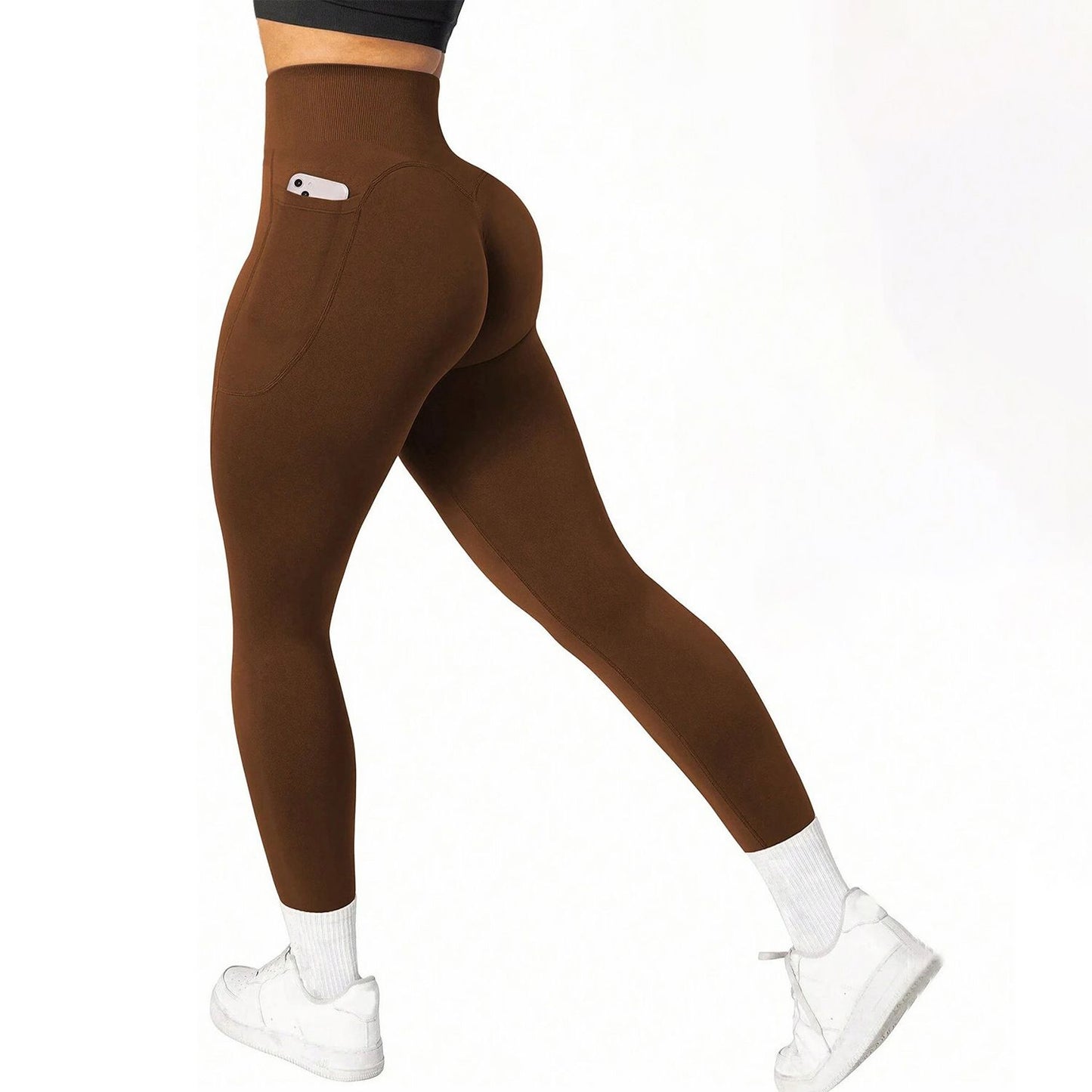 Coffee leggings worn by a person on a white background
