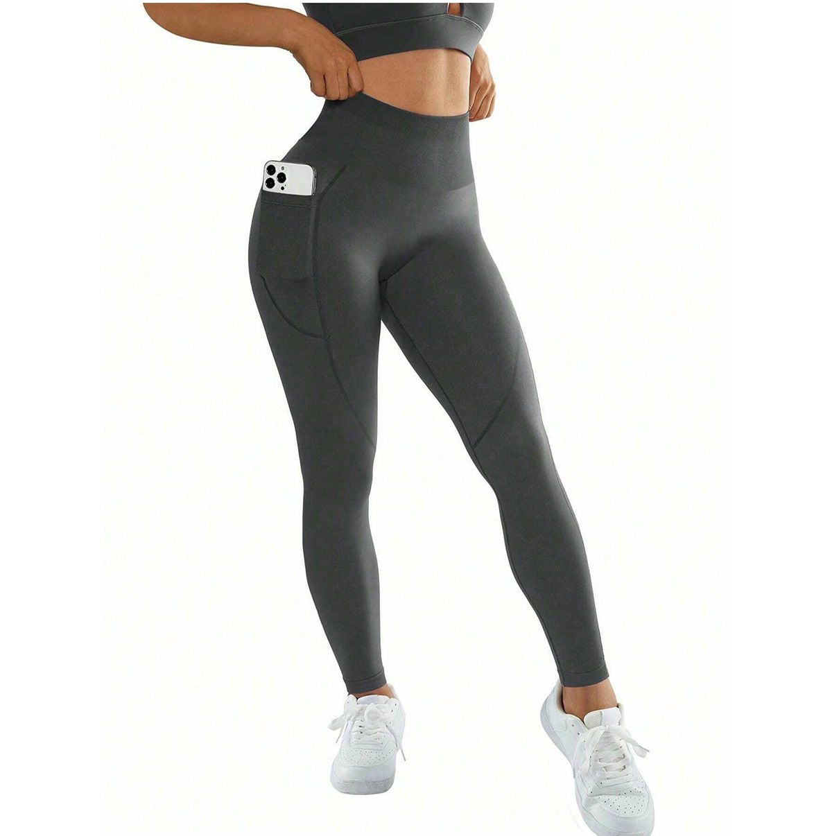 Person wearing gray leggings with a white background