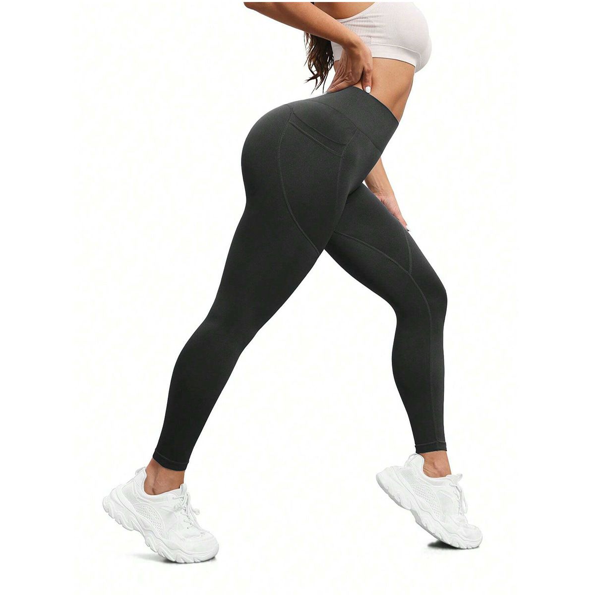 Dark Grey leggings worn by a person on a white background.