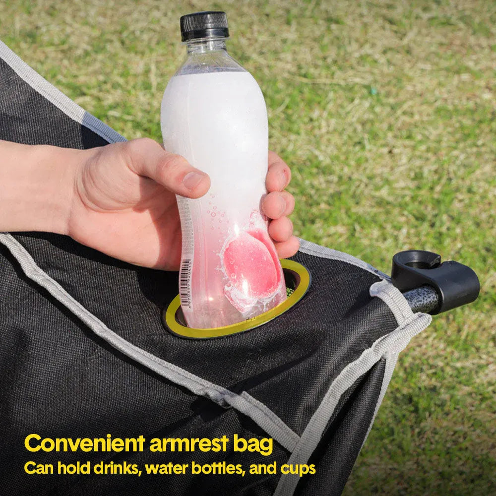 Person holding a bottle with ice cubes in a convenient armrest bag on a grassy background